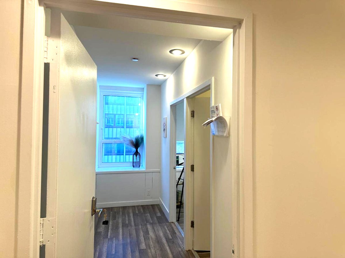 Clinic hallway with a window at the end