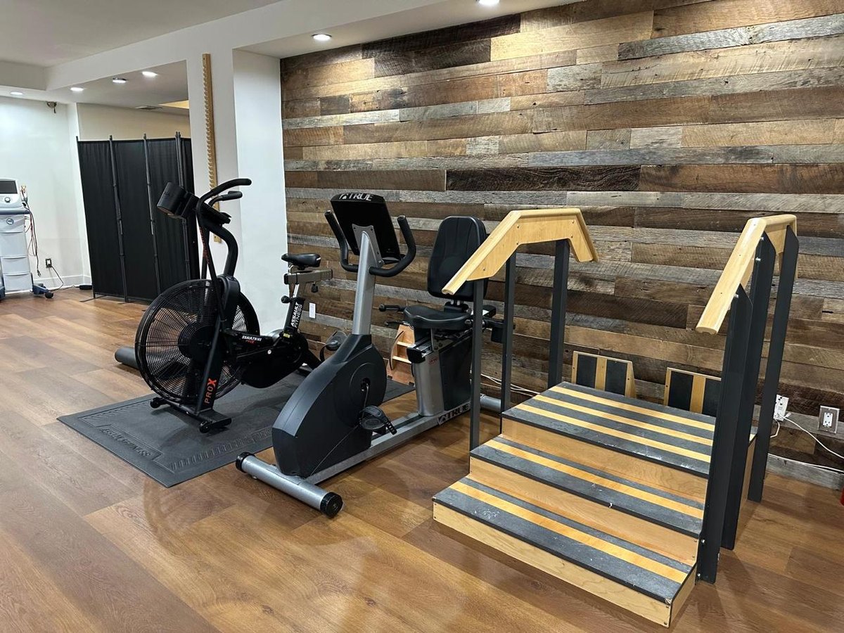 Rehabilitation gym with an air bike and training stairs